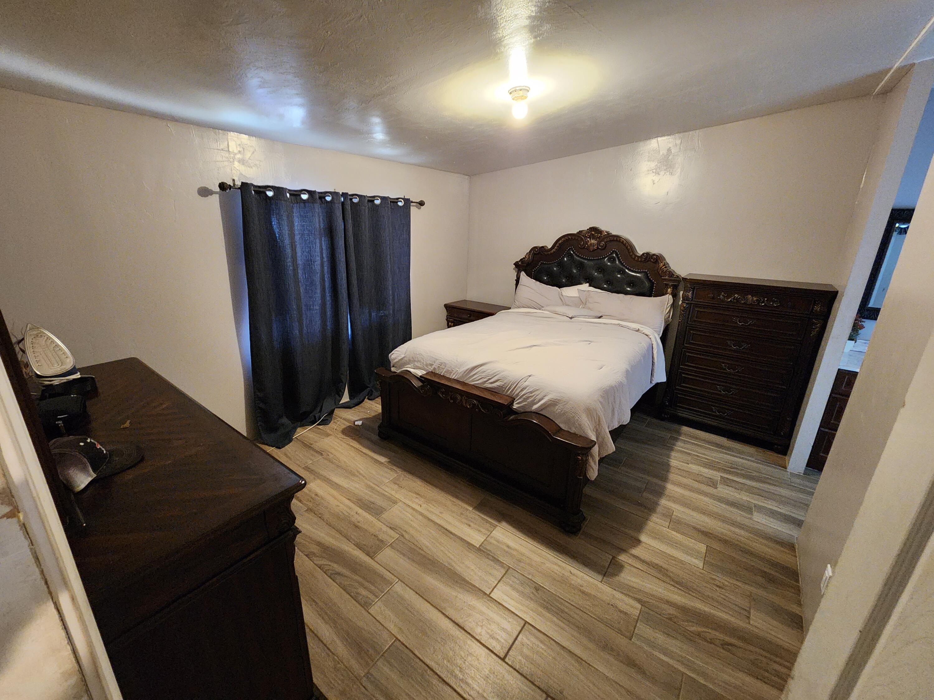 79550 Ave 40, Unit 5 Indio, CA 92203 - Photo 4 of 6 a bedroom with a bed and a dresser