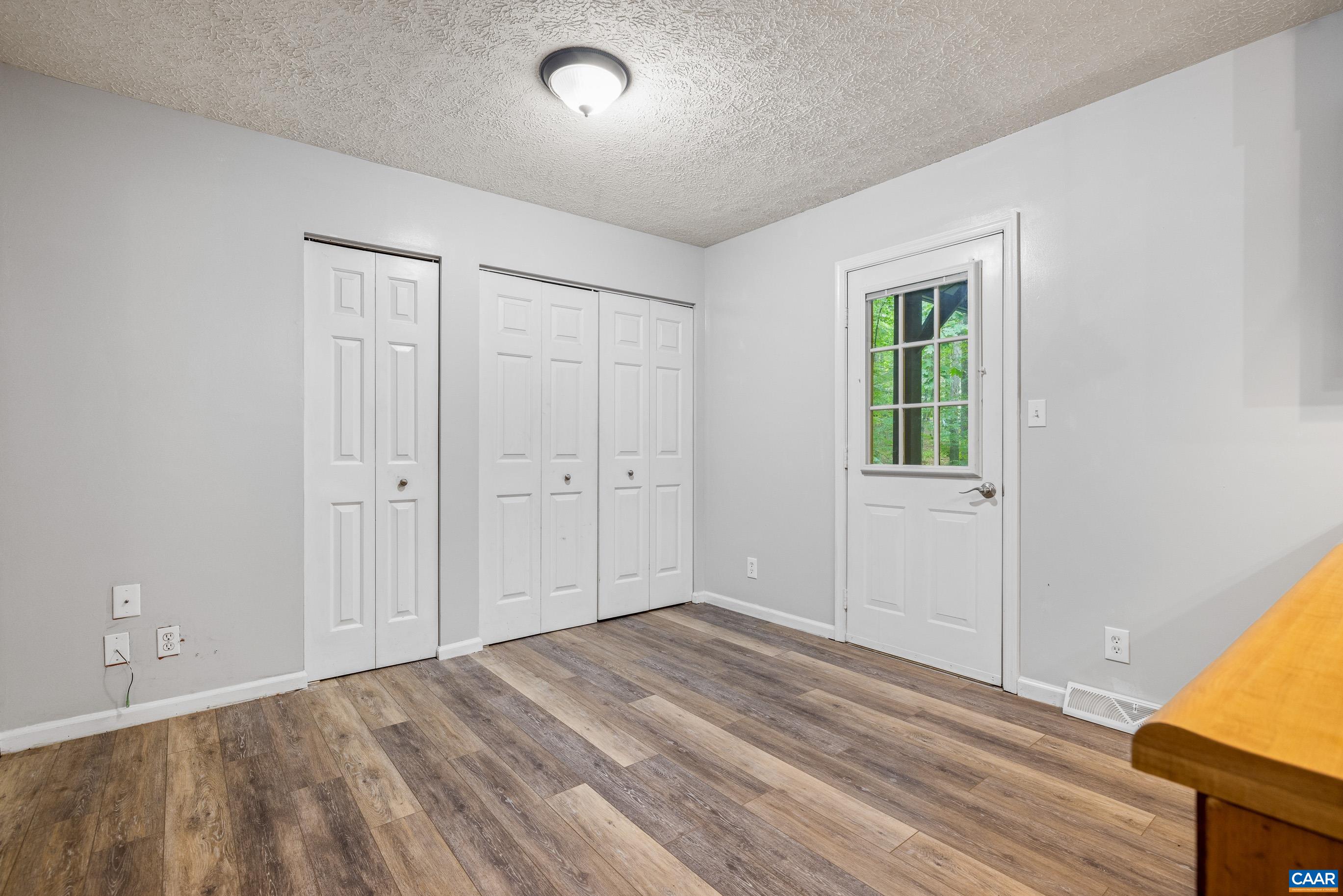 45 Colonial Road Palmyra, VA 22963 - Photo 15 of 29 wooden floor in an empty room with a window