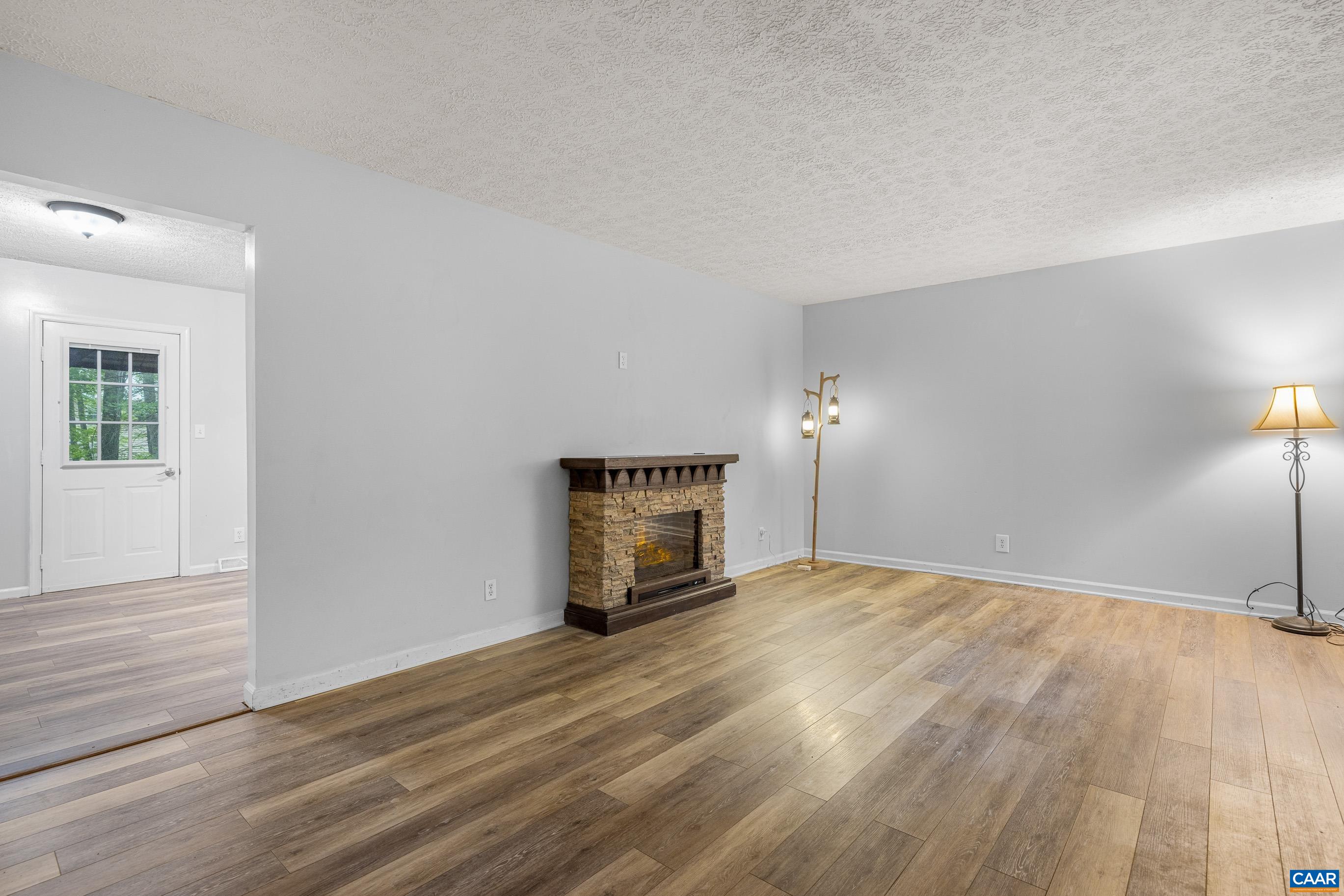 45 Colonial Road Palmyra, VA 22963 - Photo 8 of 29 a view of an empty room with wooden floor and a window