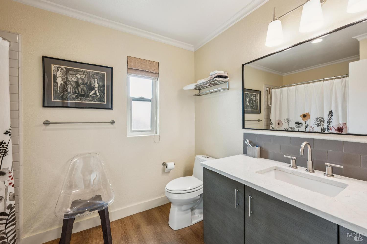 19167 Robinson Road, Unit Y Sonoma, CA 95476 - Photo 20 of 32 a bathroom with a toilet a sink and mirror