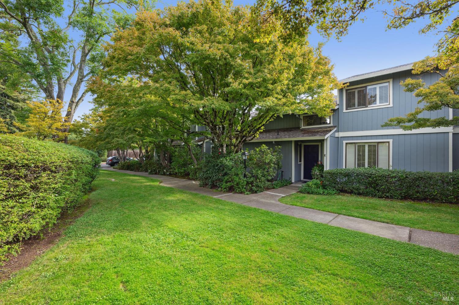 19167 Robinson Road, Unit Y Sonoma, CA 95476 - Photo 28 of 32 a front view of a house with a yard and trees