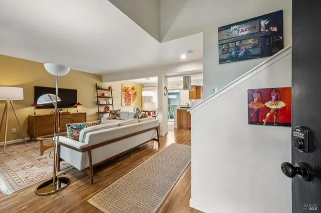 a view of a living room and dining room