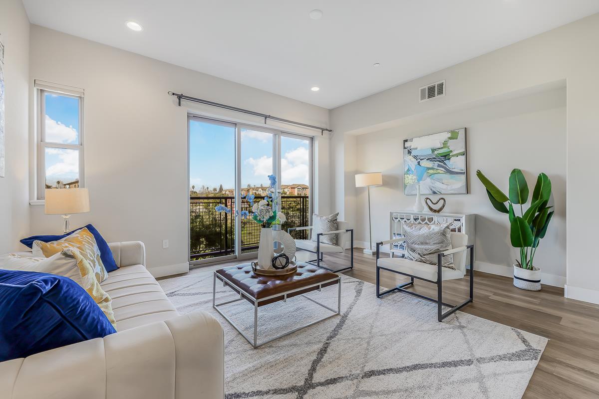 1715 Hazelnut Lane Milpitas, CA 95035 - Photo 1 of 1 a living room with furniture and wooden floor