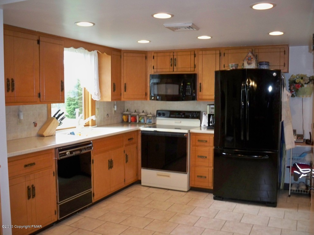 North Road Stroudsburg, PA 18360 - Photo 8 of 23 a kitchen with a sink stainless steel appliances and cabinets