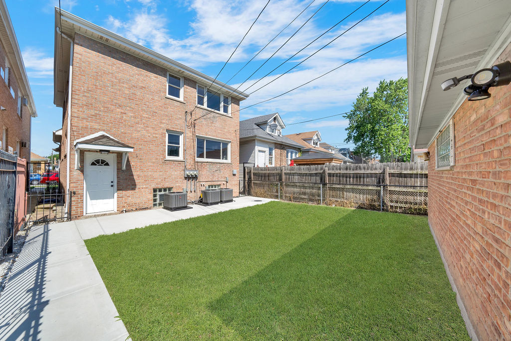 7245 South Washtenaw Avenue, Unit 1 Chicago, IL 60629 - Photo 14 of 14 a view of a house with a yard porch and sitting area