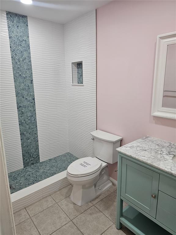 14800 Walsingham Road, Unit 1215 Largo, FL 33774 - Photo 11 of 26 a bathroom with a granite countertop toilet and a sink