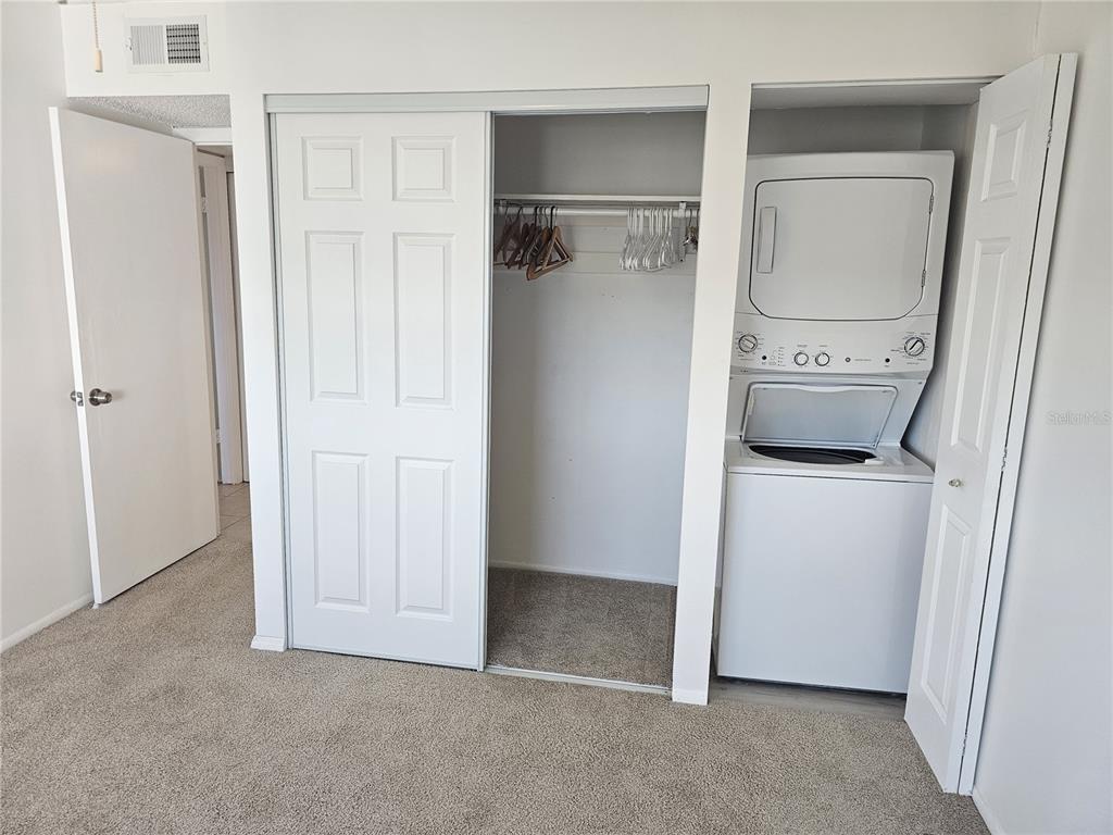 14800 Walsingham Road, Unit 1215 Largo, FL 33774 - Photo 14 of 26 a view of a storage & utility room with washer and dryer