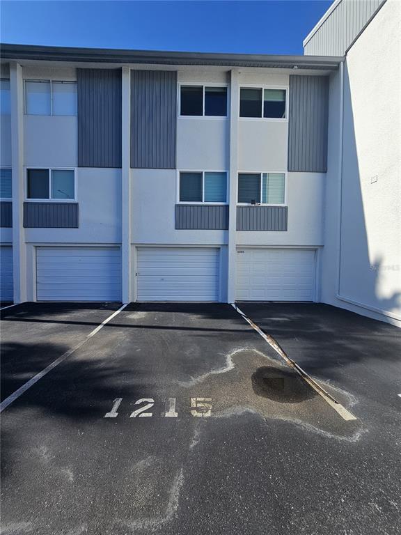 14800 Walsingham Road, Unit 1215 Largo, FL 33774 - Photo 16 of 26 a front view of a house with a road