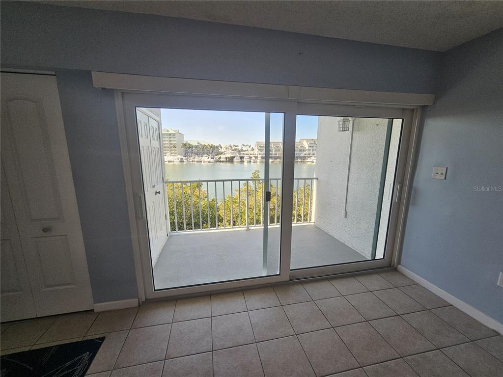 14800 Walsingham Road, Unit 1215 Largo, FL 33774 - Photo 21 of 26 a view of an empty room and window