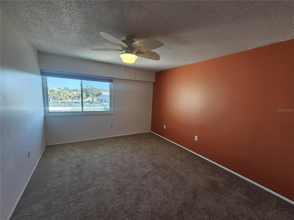 14800 Walsingham Road, Unit 1215 Largo, FL 33774 - Photo 24 of 26 an empty room with windows and closet