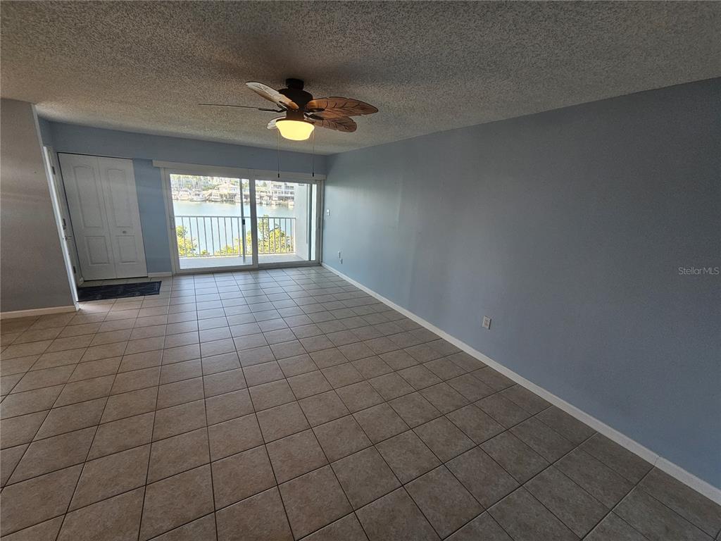 14800 Walsingham Road, Unit 1215 Largo, FL 33774 - Photo 3 of 26 a view of an empty room and window