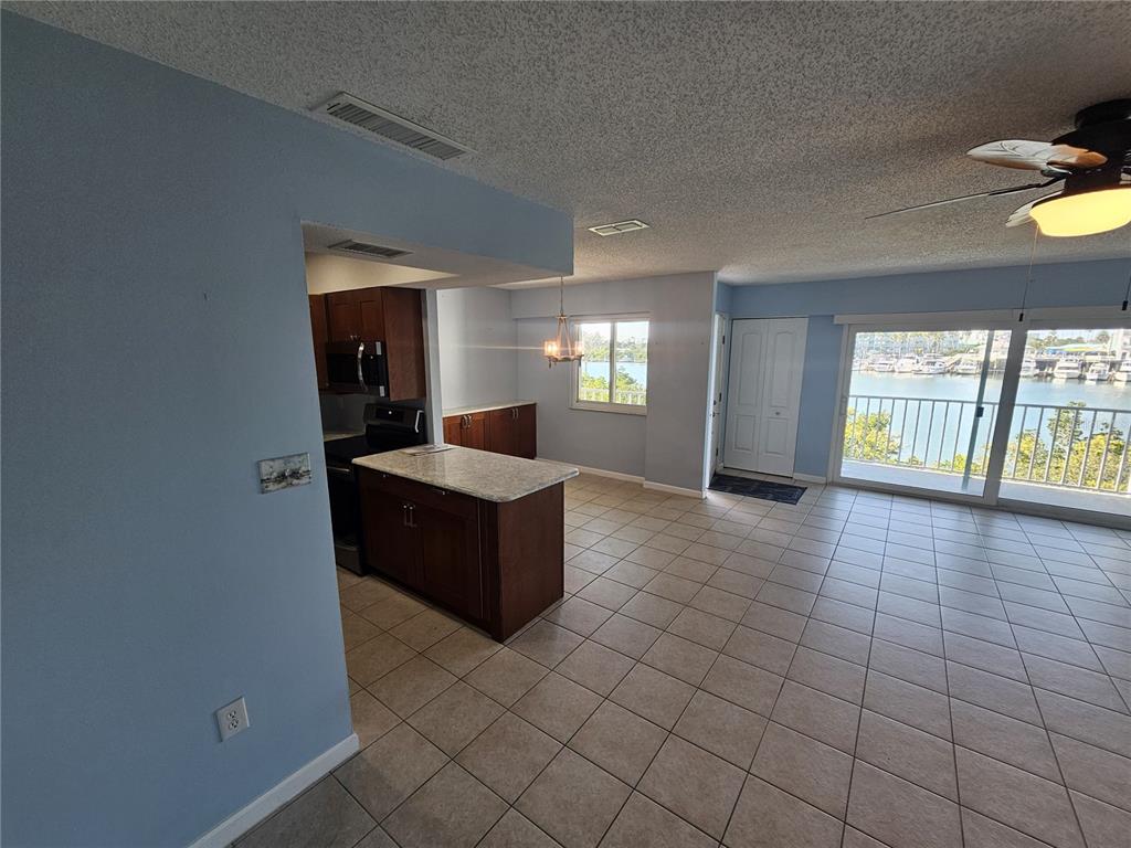 14800 Walsingham Road, Unit 1215 Largo, FL 33774 - Photo 4 of 26 a view of an empty room with a window