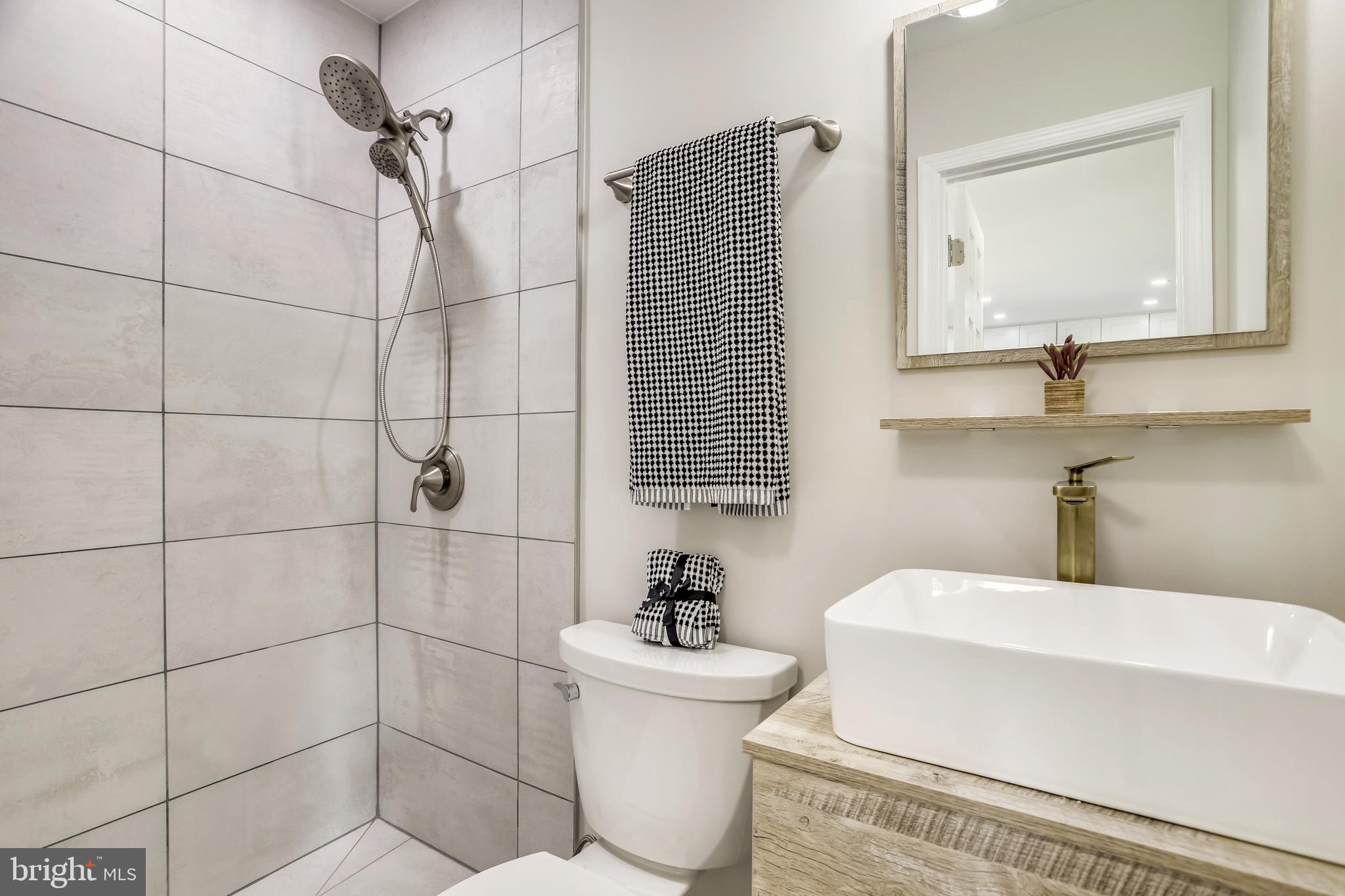 7303 Exmore Street Springfield, VA 22150 - Photo 19 of 36 New bathroom with modern touches.