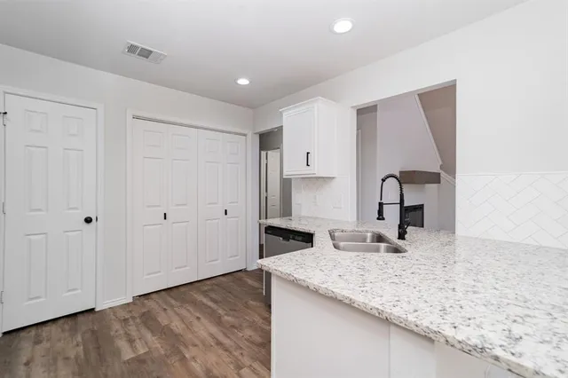 a kitchen with granite countertop a sink and a granite counter tops