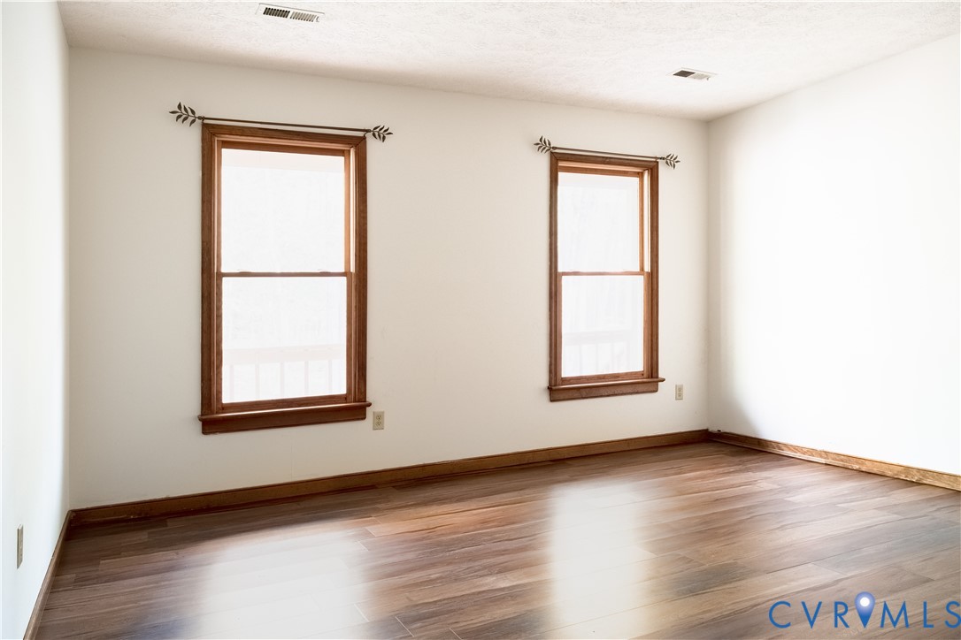 2477 Calno Road Hanover, VA 23069 - Photo 11 of 33 an empty room with wooden floor and windows