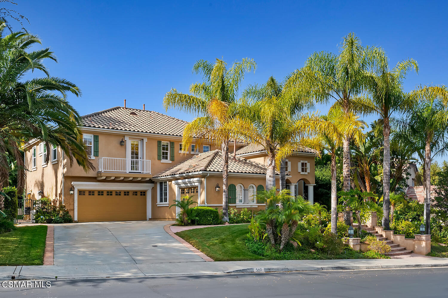 569 Rustic Hills Drive Simi Valley, CA 93065 - Photo 2 of 59 a front view of a house with a garden
