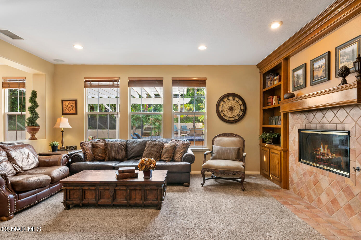 569 Rustic Hills Drive Simi Valley, CA 93065 - Photo 11 of 59 a living room with furniture a fireplace and a large window