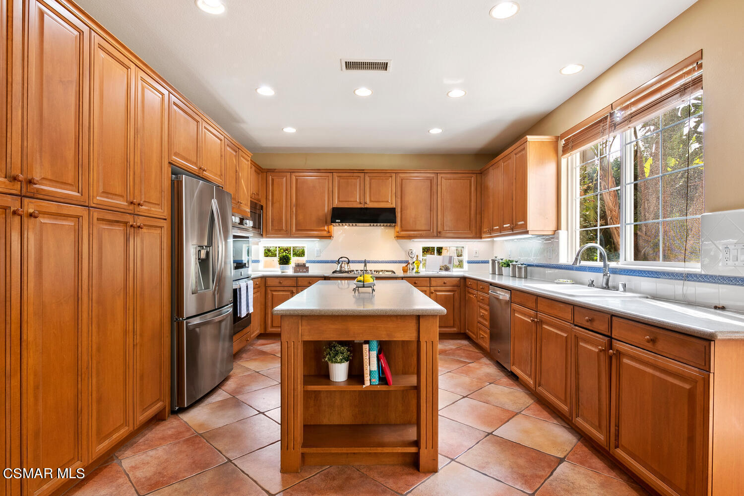 569 Rustic Hills Drive Simi Valley, CA 93065 - Photo 15 of 59 a kitchen with stainless steel appliances granite countertop a refrigerator and a sink