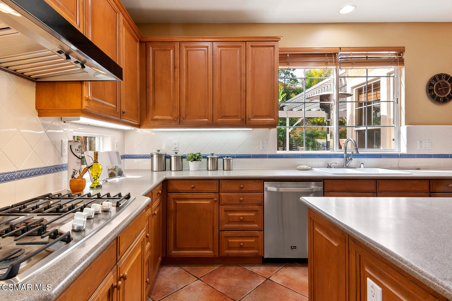 569 Rustic Hills Drive Simi Valley, CA 93065 - Photo 18 of 59 a kitchen with a sink stove and cabinets