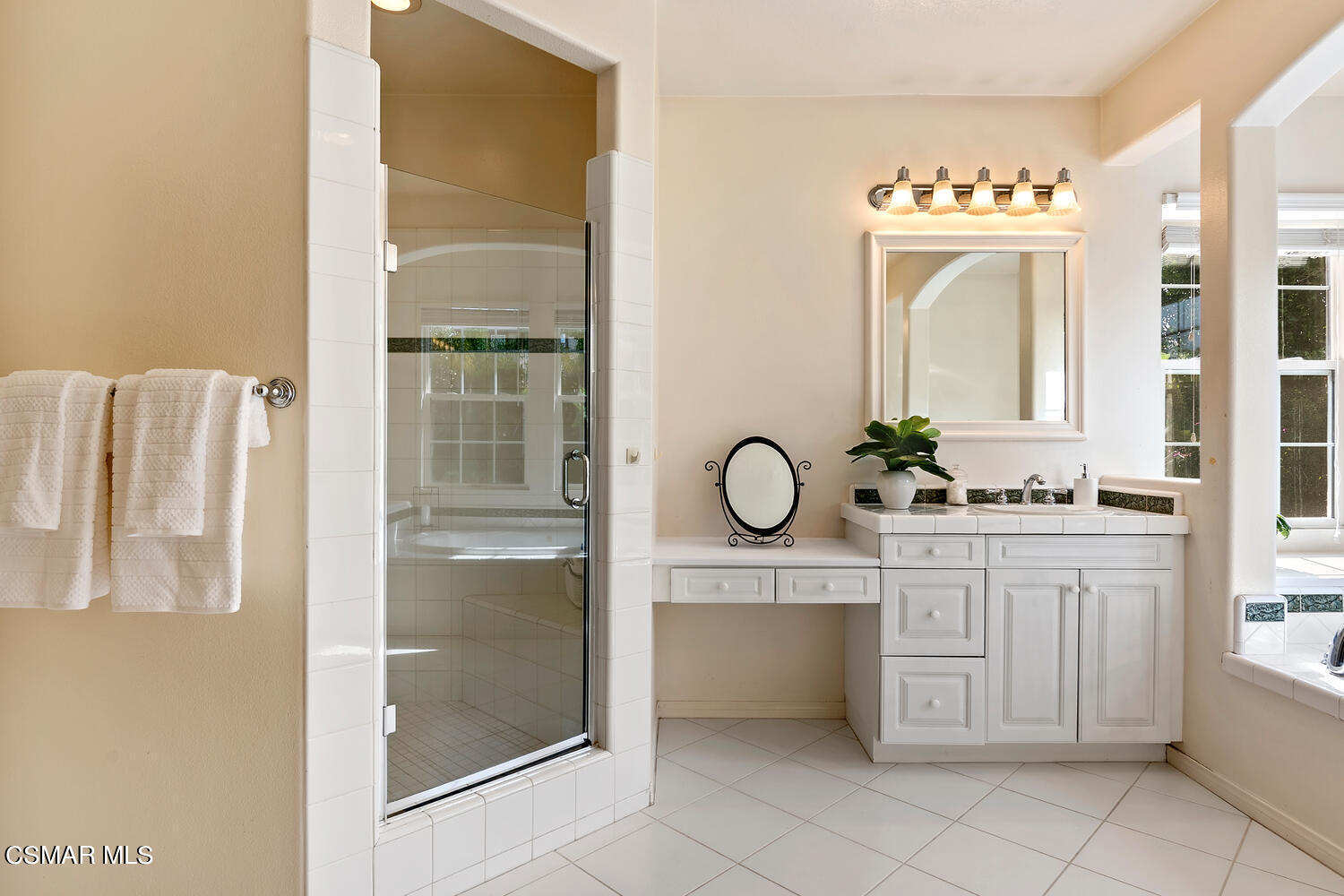 569 Rustic Hills Drive Simi Valley, CA 93065 - Photo 29 of 59 a bathroom with a sink vanity and a mirror