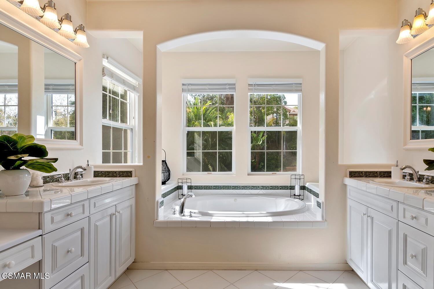 569 Rustic Hills Drive Simi Valley, CA 93065 - Photo 31 of 59 a bathroom with a granite countertop tub sink a window and mirror
