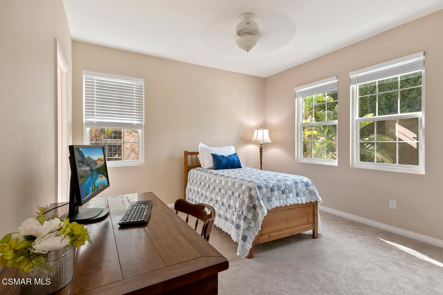 569 Rustic Hills Drive Simi Valley, CA 93065 - Photo 36 of 59 a bedroom with a bed and a table
