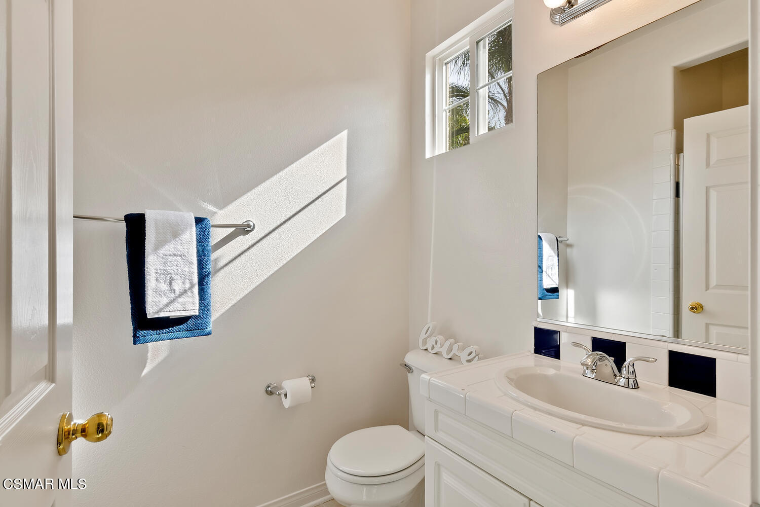 569 Rustic Hills Drive Simi Valley, CA 93065 - Photo 37 of 59 a bathroom with a sink vanity mirror and toilet
