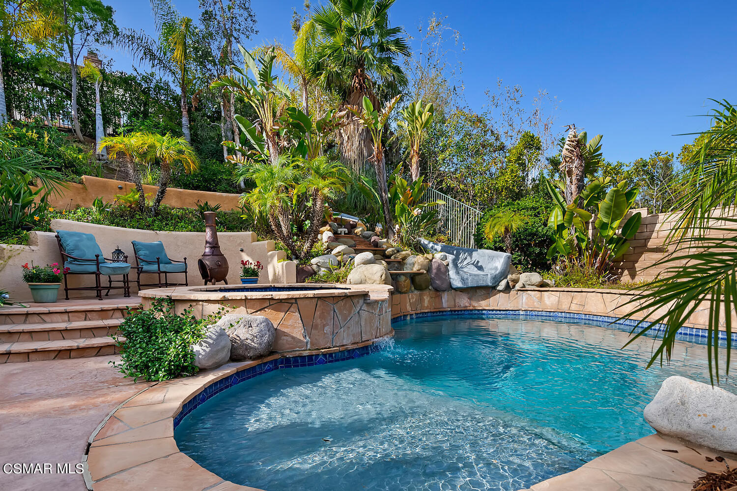 569 Rustic Hills Drive Simi Valley, CA 93065 - Photo 42 of 59 a view of a backyard with plants and patio