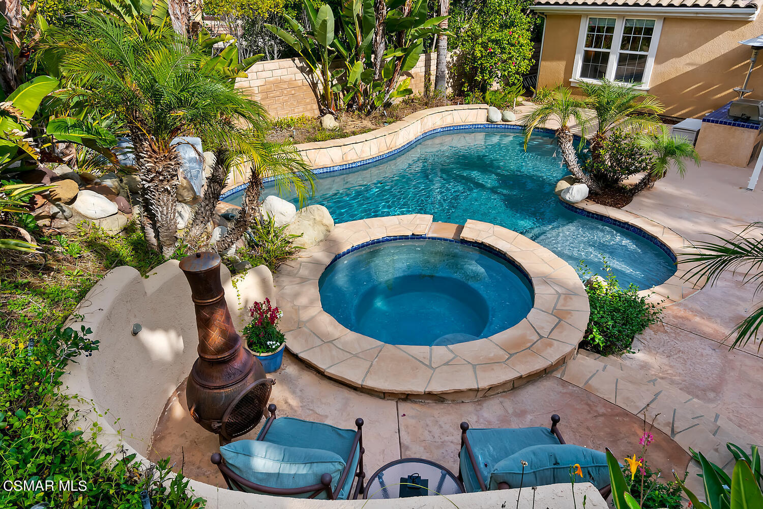 569 Rustic Hills Drive Simi Valley, CA 93065 - Photo 44 of 59 an aerial view of a house with garden space and swimming pool