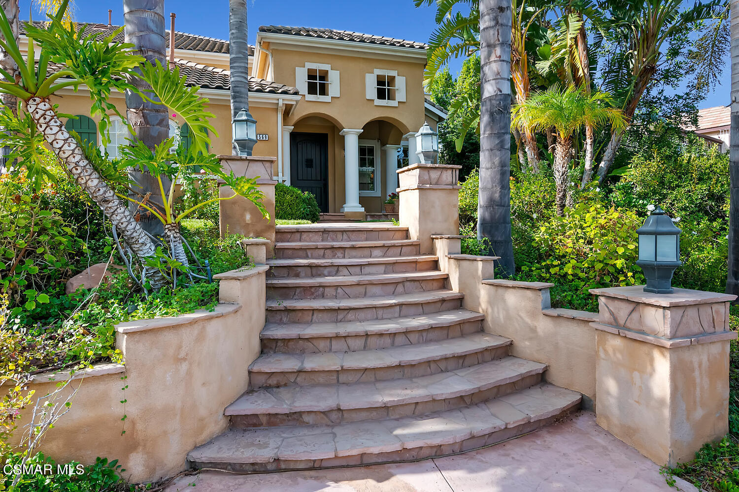 569 Rustic Hills Drive Simi Valley, CA 93065 - Photo 48 of 59 a view of a house with potted plants and a fountain