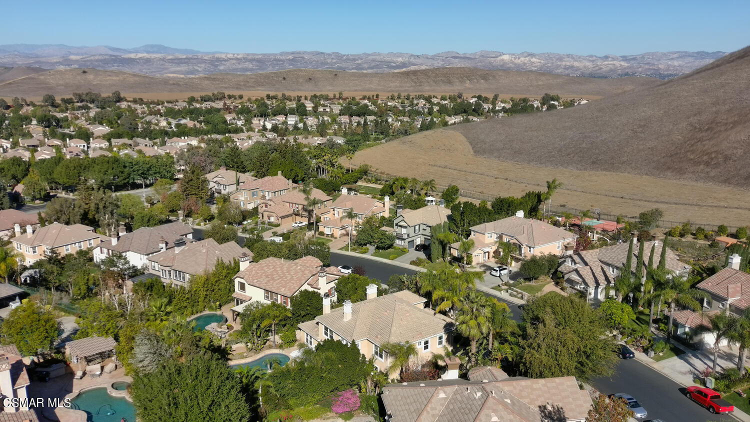 569 Rustic Hills Drive Simi Valley, CA 93065 - Photo 55 of 59 an aerial view of residential houses with outdoor space and mountain view