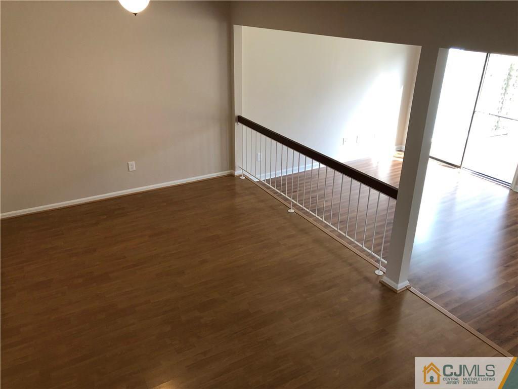 1804 Timber Oaks Road Edison, NJ 08820 - Photo 12 of 23 a view of an empty room with wooden floor