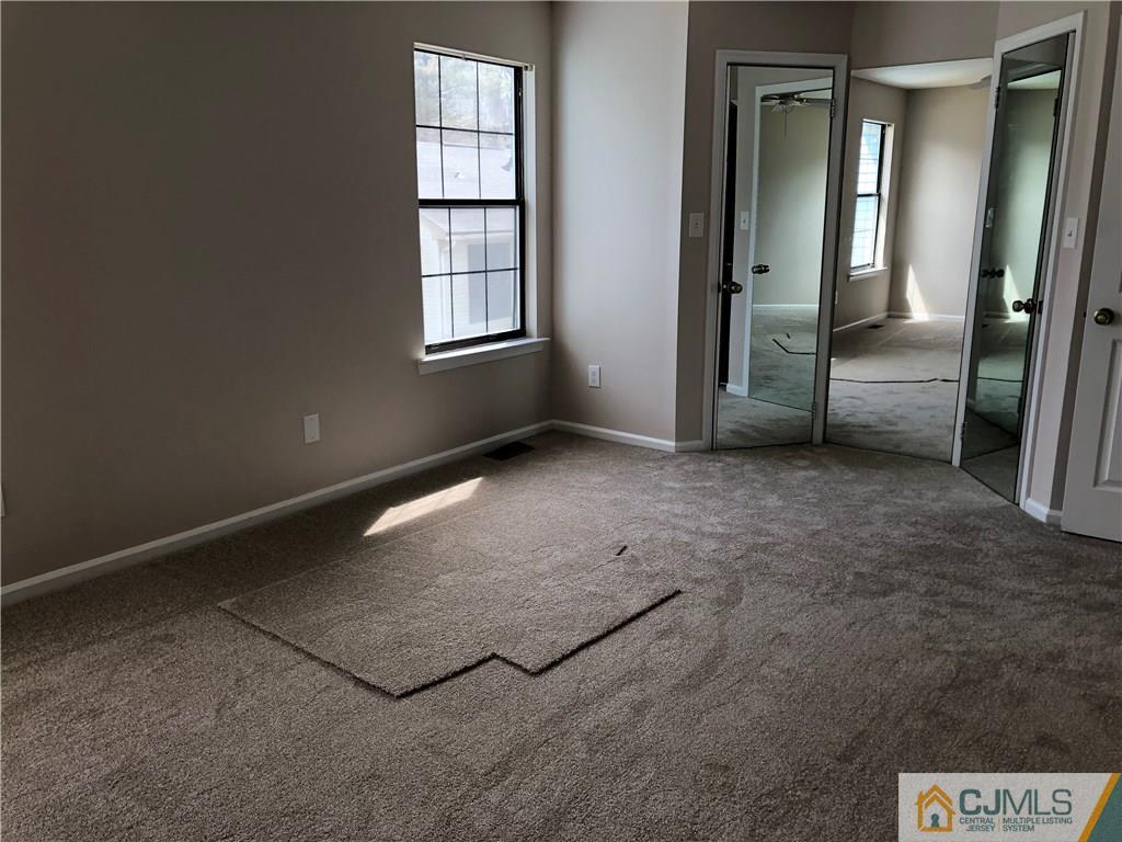1804 Timber Oaks Road Edison, NJ 08820 - Photo 20 of 23 an empty room with windows
