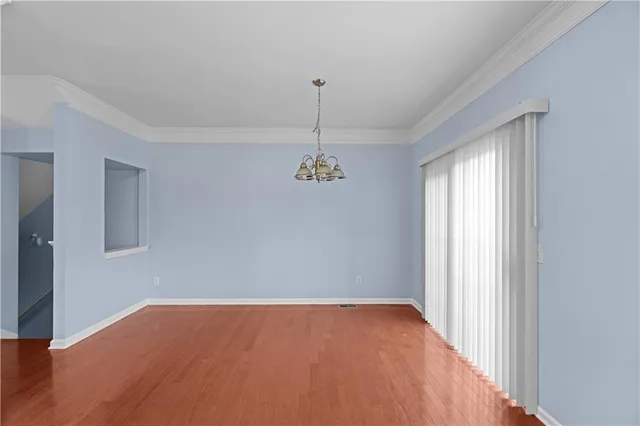 a view of a room with a ceiling fan
