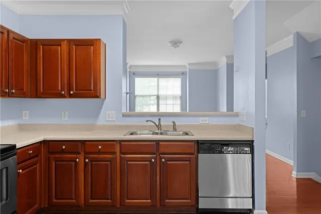 a kitchen with granite countertop a sink and cabinets