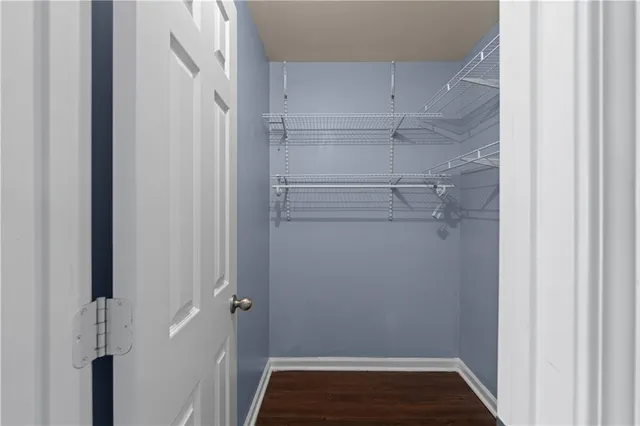 a view of storage and utility room with racks on the wall