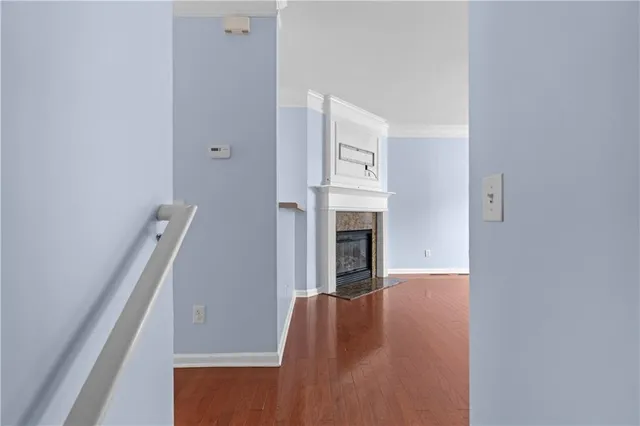 a view of an empty room with fire place