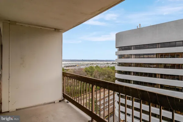 a view of balcony with a potted plant
