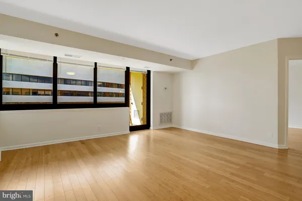 a view of an empty room with a window