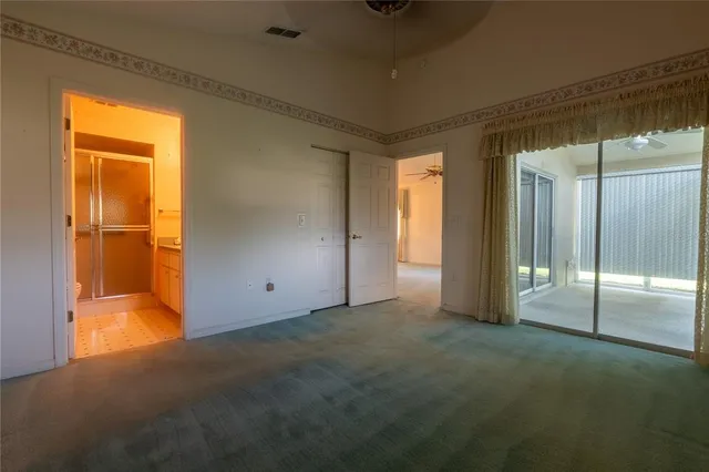 an empty room with sliding door