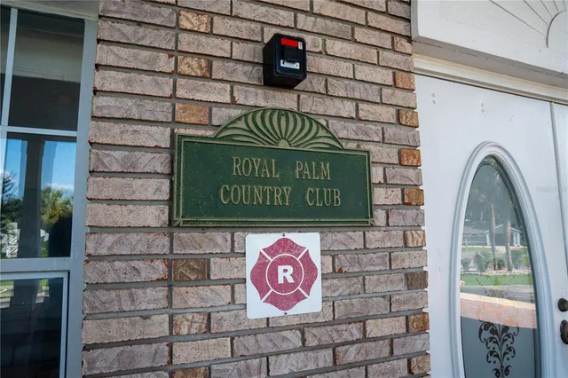 a street sign on a brick wall