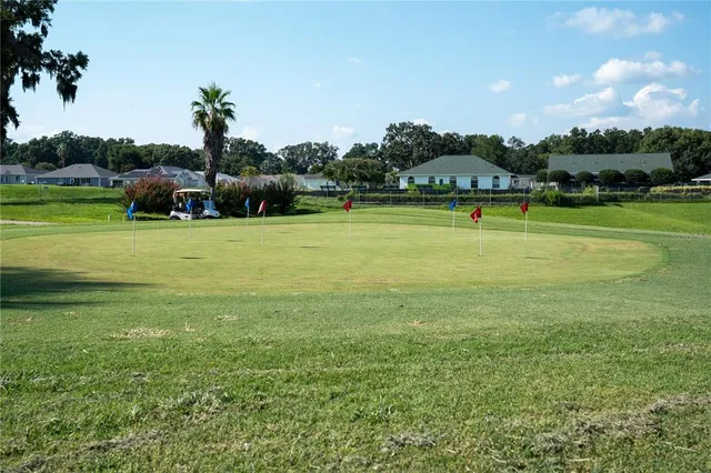 a view of a swimming pool and a yard