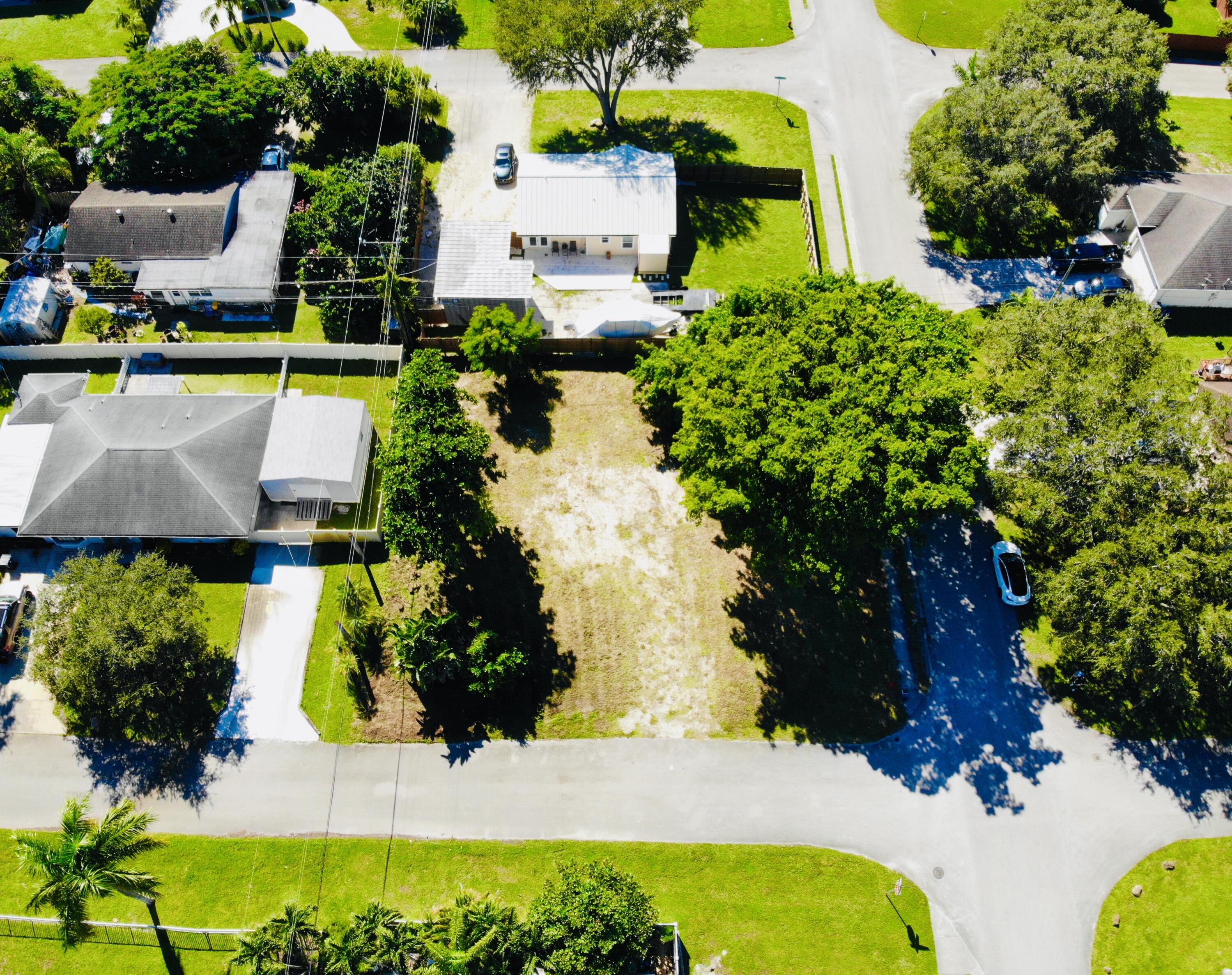 4802 Bonanza Road Lake Worth, FL 33467 - Photo 3 of 10 an aerial view of a house with a swimming pool