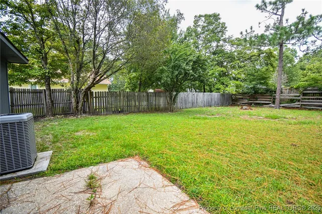 a swimming pool with wooden fence