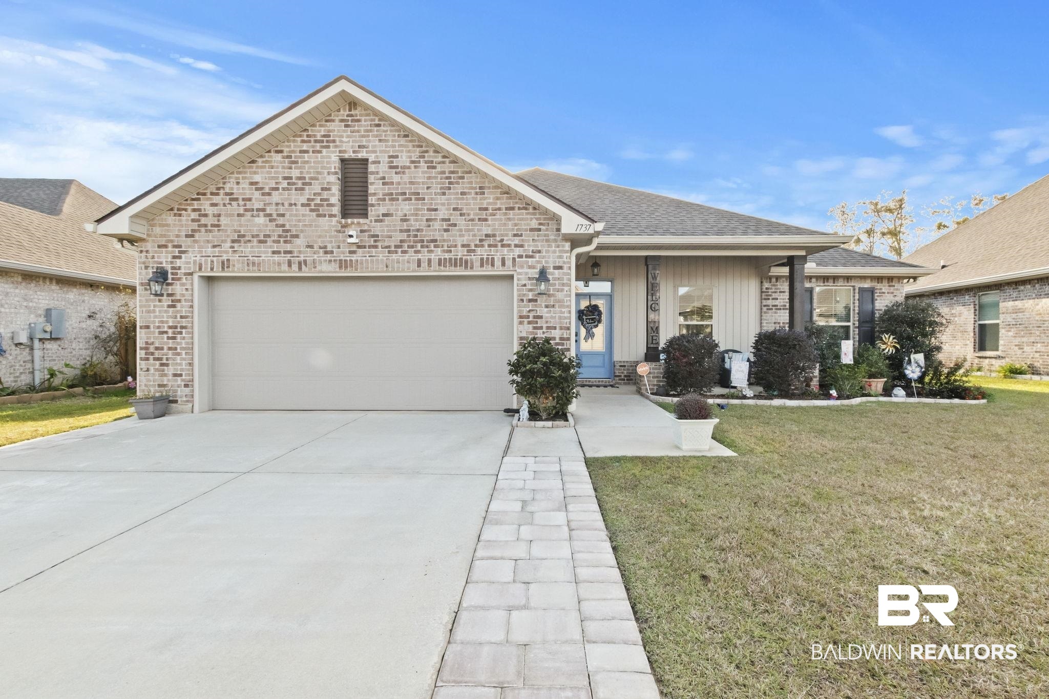 1737 Vivace Drive Foley, AL 36535 - Photo 1 of 73 View of front of property featuring a garage and a front yard