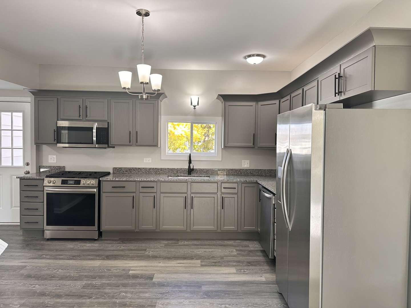 210 West Hall Street Leland, IL 60531 - Photo 13 of 36 a kitchen with stainless steel appliances granite countertop a refrigerator a stove top oven a sink and dishwasher