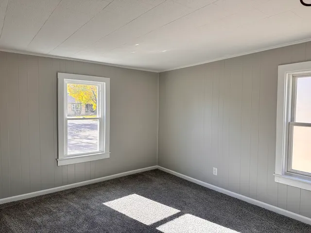 an empty room with windows