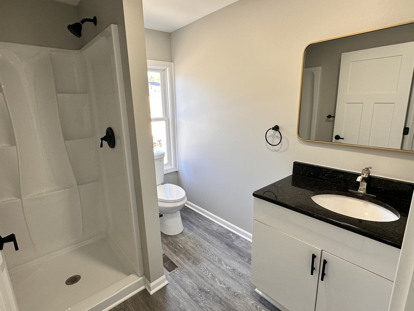 210 West Hall Street Leland, IL 60531 - Photo 20 of 36 a bathroom with a sink a toilet and shower