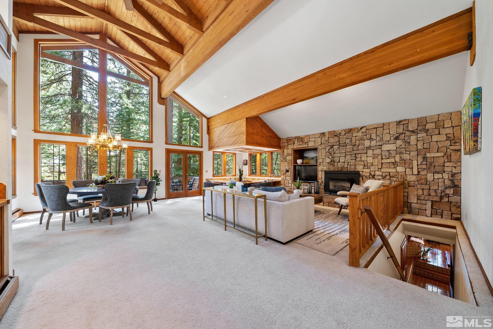 106 Jobs Peak Road Incline Village, NV 89451 - Photo 12 of 40 a living room with furniture a fireplace and large windows