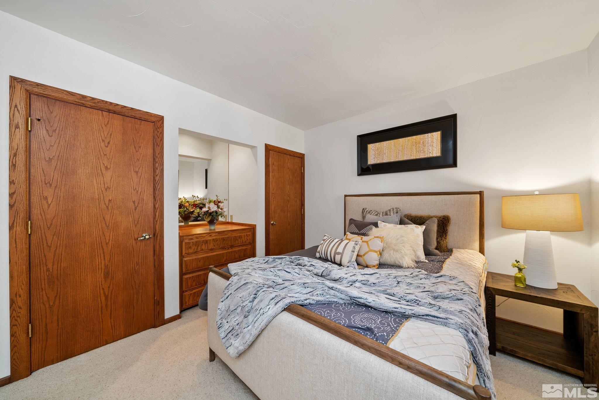 106 Jobs Peak Road Incline Village, NV 89451 - Photo 14 of 40 a bedroom with a bed and a lamp